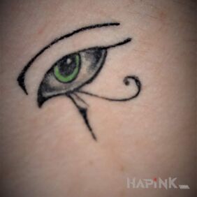 Tattoo Eye of Horus on the neck motif: black and gray style: graphic / illustrative
