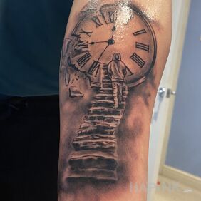 Tattoo Clock with stairs On the arm motif: black and gray style: realistic