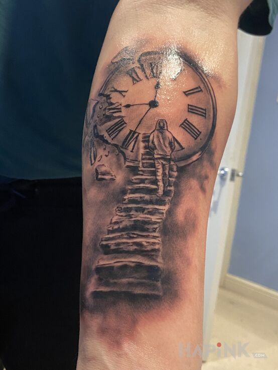 Tattoo Zegar ze schodami in characters motif and realistic style on the forearm