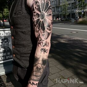 Tattoo Continuation of the client's sleeve with munster on the upper arm motif: black and gray style: realistic