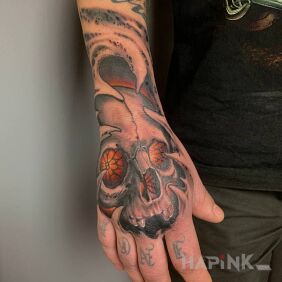 Tattoo Realism on the hand motif: skulls style: realistic