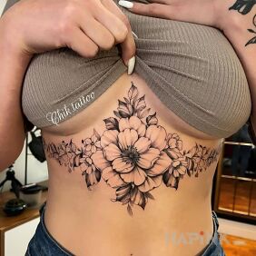 Tattoo One big and a few small flowers on the stomach motif: flowers style: realistic
