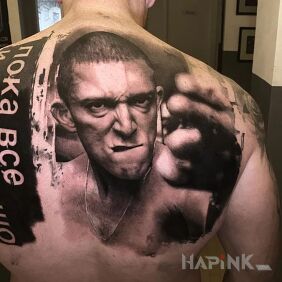 Tattoo Hate on the back motif: faces style: realistic