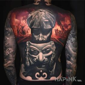Tattoo The revolution is near On the arm motif: faces style: realistic