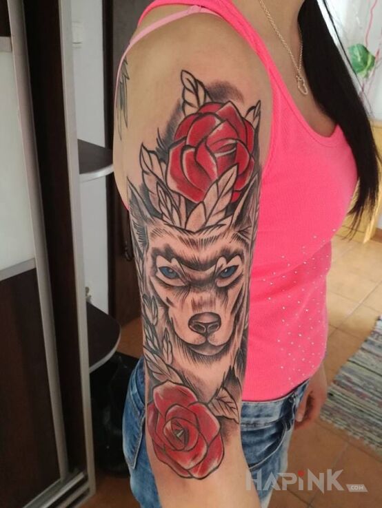 Tattoo :D in animals motif on the upper arm