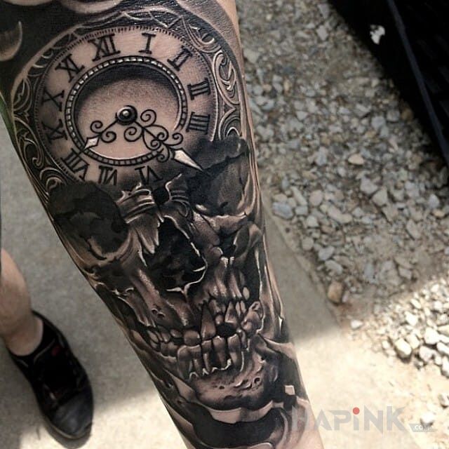 Tattoo Zeit in skulls motif on the forearm