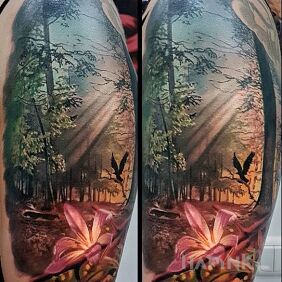 Tattoo Realistic forest on the upper arm motif: nature style: realistic