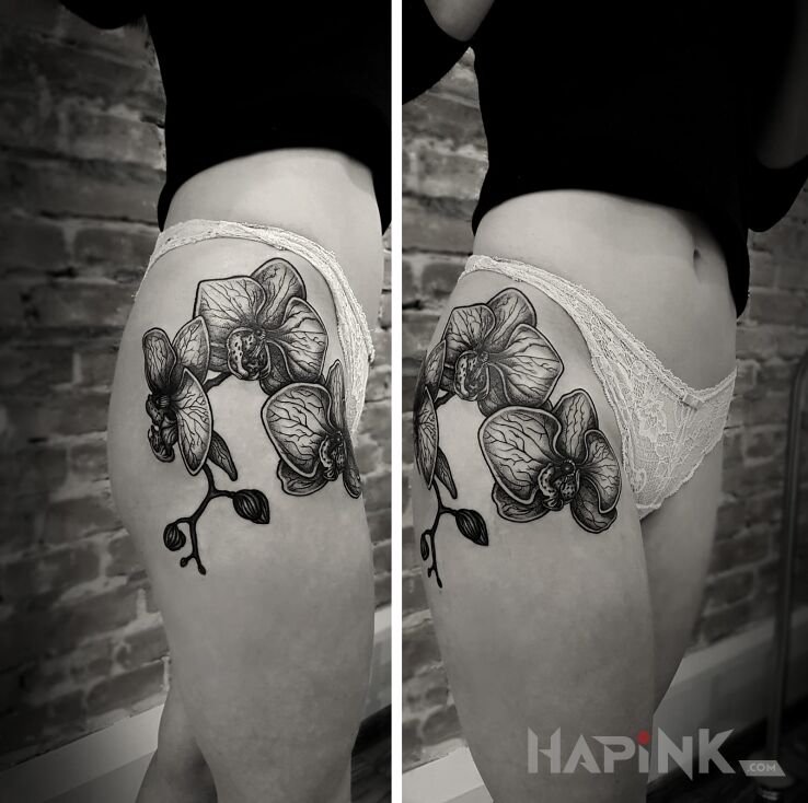 Tattoo Orchid in sexy motif on the leg