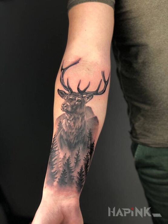 Tattoo Deer in black and gray motif and realistic style On the arm