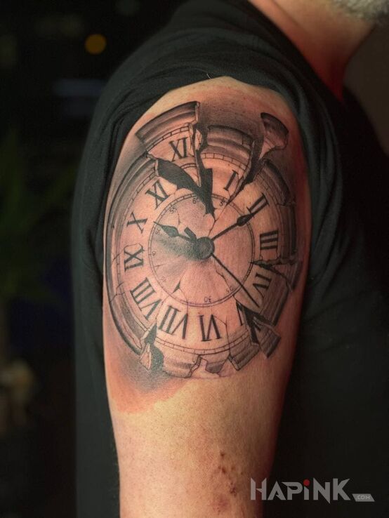 Tattoo The clock in objects motif and realistic style On the arm