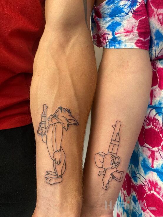 Tattoo Tom & Jerry in characters motif and contour / linework style on the forearm