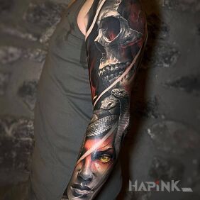 Tattoo Medusa and her victim on the upper arm motif: skulls style: realistic