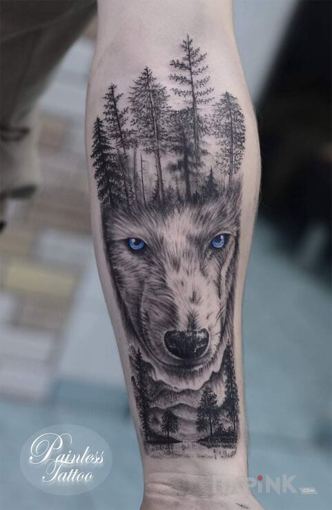 Tattoo Wilczek in black and gray motif and realistic style On the arm
