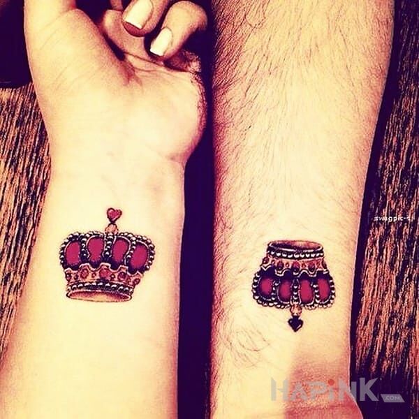 Tattoo Korony in Love motif on the forearm