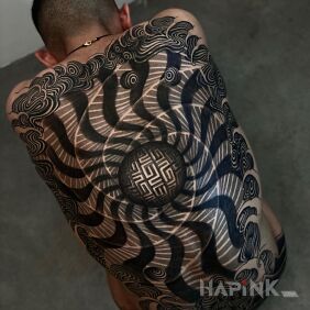 Tattoo Black spiral on the back motif: black and gray style: geometric