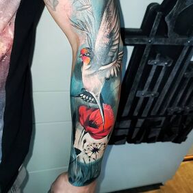Tattoo Swallow On the arm motif: colorful style: realistic