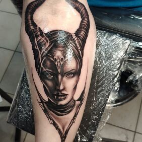 Tattoo Diabolina on the forearm motif: characters style: realistic