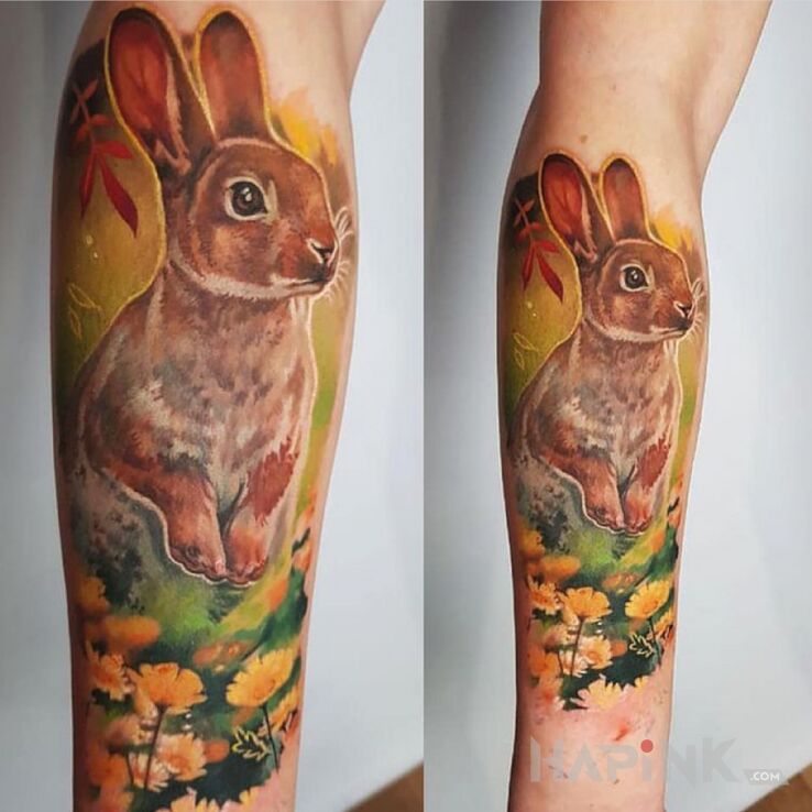 Tattoo Królik in colorful motif and realistic style On the arm