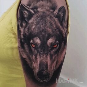 Tattoo Wolf On the arm motif: animals style: realistic