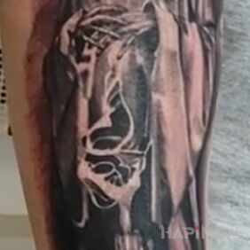 Tattoo Little Demon on the forearm motif: black and gray style: realistic