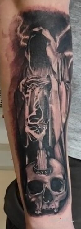 Tattoo Demonek in demons motif and realistic style On the arm