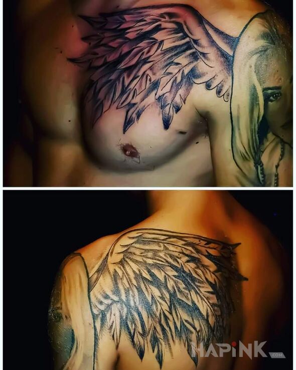 Tattoo 😉 skrzydła in black and gray motif and realistic style on the chest