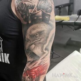 Tattoo Poland on the offensive on the upper arm motif: characters style: realistic