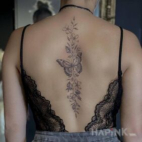Tattoo Butterfly in the middle of the back on the back motif: floral style: realistic