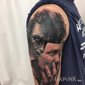 Tattoo Jocker and mask on the upper arm motif: characters