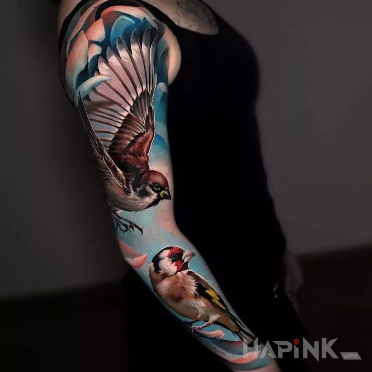 Tattoo Wróbelinio in colorful motif and realistic style on the forearm