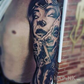 Tattoo MoloTattoo on the upper arm motif: dark style: realistic