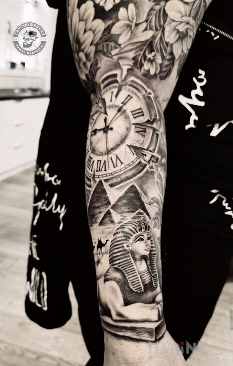 Tattoo Egipt in objects motif and realistic style on the forearm