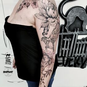 Tattoo Female sleeve nature composition on the forearm motif: black and gray style: graphic / illustrative