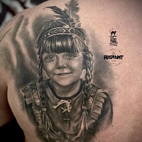 Tattoo Little Indian Girl on the back motif: faces style: realistic