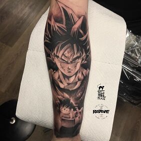 Tattoo Dragon ball on the forearm motif: black and gray style: graphic / illustrative
