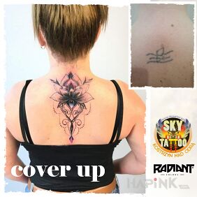 Tattoo Mandala cover-up on female back on the back motif: ornaments style: graphic / illustrative