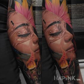 Tattoo Fire in the bulb on the forearm motif: faces style: realistic