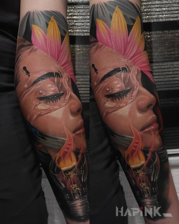 Tattoo Ogień w żarówie in colorful motif and realistic style On the arm