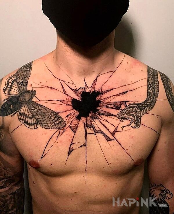 Tattoo Czarna dziara in insects motif and blackwork / blackout style on the chest