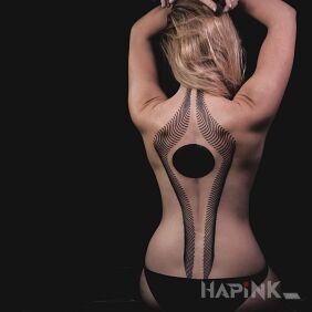 Tattoo Black sphere on the back motif: black and gray style: blackwork / blackout