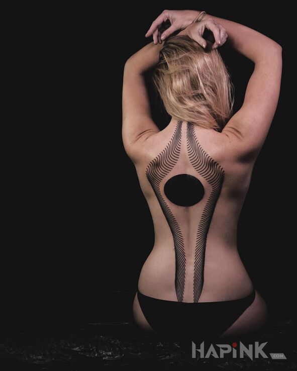 Tattoo Czarna kula in other motif and blackwork / blackout style on the back