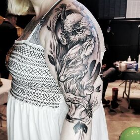 Tattoo Forest animals on the upper arm motif: black and gray style: graphic / illustrative
