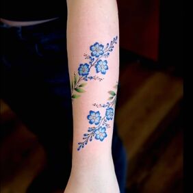 Tattoo Subtle floral band On the arm motif: flowers style: realistic
