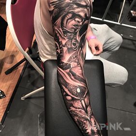 Tattoo Shamaness in wolf fur on the upper arm motif: animals style: realistic