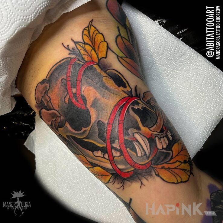 Tattoo Czaszka in animals motif and neo-traditional style on the bicep