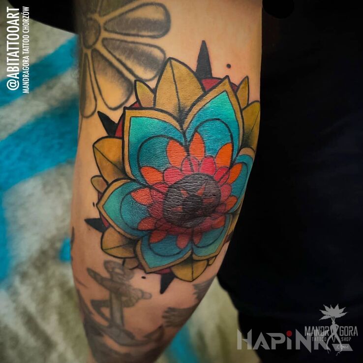 Tattoo Mandala in colorful motif and neo-traditional style On the arm