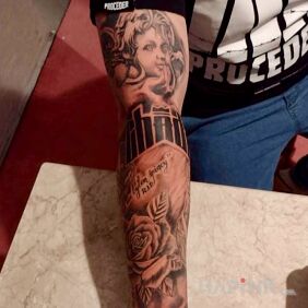 Tattoo Chada on the upper arm motif: faces style: realistic