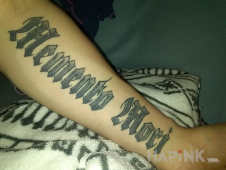 Tattoo Memento mori in lettering motif on the forearm