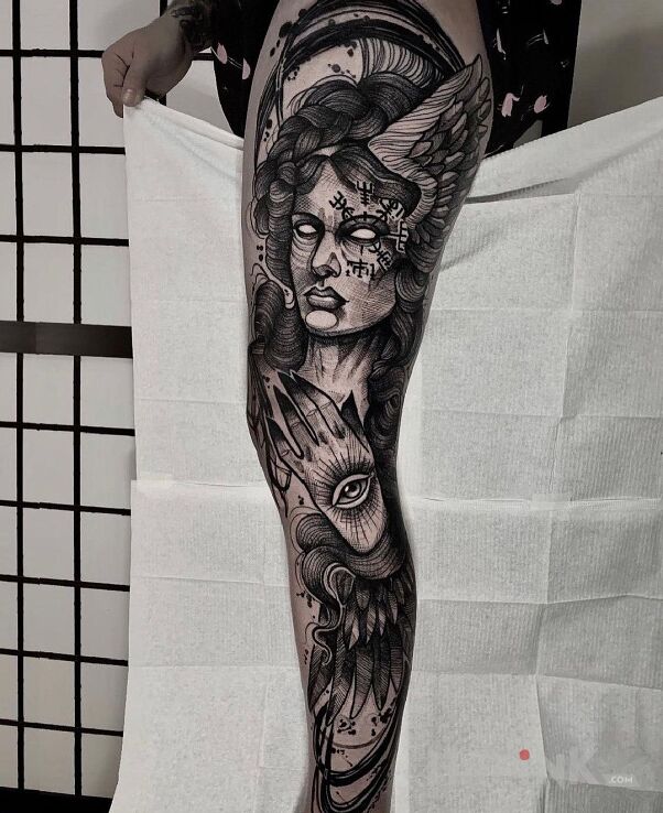 Tattoo Laska bez oczu in black and gray motif and graphic / illustrative style on the leg