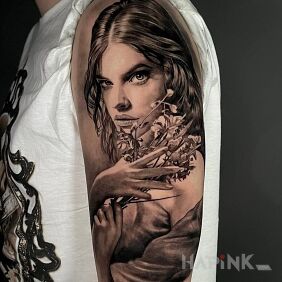 Tattoo Girl holding flowers on the upper arm motif: 3D style: realistic